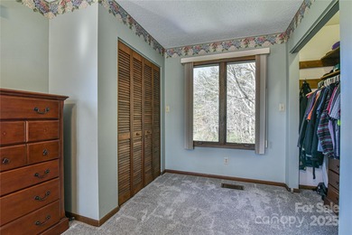 A Sunlit Corner Retreat in The Lynx - Wrapped in Woods, Light on Black Mountain Golf Course in North Carolina - for sale on GolfHomes.com, golf home, golf lot