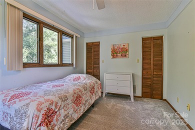 A Sunlit Corner Retreat in The Lynx - Wrapped in Woods, Light on Black Mountain Golf Course in North Carolina - for sale on GolfHomes.com, golf home, golf lot