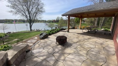 Welcome home to this beautiful, updated, unique charming rustic on Lakes of the Four Seasons Country Club in Indiana - for sale on GolfHomes.com, golf home, golf lot
