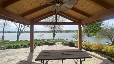 Welcome home to this beautiful, updated, unique charming rustic on Lakes of the Four Seasons Country Club in Indiana - for sale on GolfHomes.com, golf home, golf lot