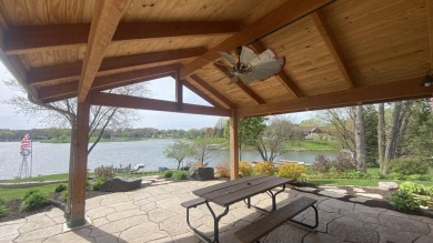 Welcome home to this beautiful, updated, unique charming rustic on Lakes of the Four Seasons Country Club in Indiana - for sale on GolfHomes.com, golf home, golf lot
