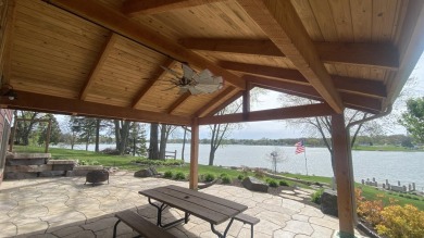 Welcome home to this beautiful, updated, unique charming rustic on Lakes of the Four Seasons Country Club in Indiana - for sale on GolfHomes.com, golf home, golf lot