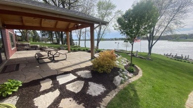 Welcome home to this beautiful, updated, unique charming rustic on Lakes of the Four Seasons Country Club in Indiana - for sale on GolfHomes.com, golf home, golf lot