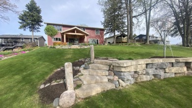 Welcome home to this beautiful, updated, unique charming rustic on Lakes of the Four Seasons Country Club in Indiana - for sale on GolfHomes.com, golf home, golf lot