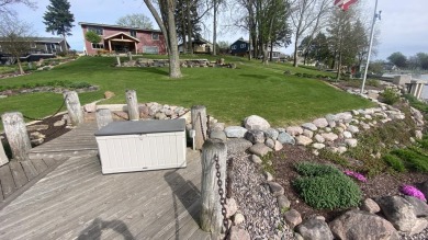 Welcome home to this beautiful, updated, unique charming rustic on Lakes of the Four Seasons Country Club in Indiana - for sale on GolfHomes.com, golf home, golf lot