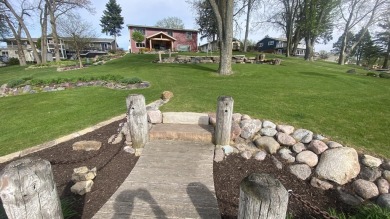Welcome home to this beautiful, updated, unique charming rustic on Lakes of the Four Seasons Country Club in Indiana - for sale on GolfHomes.com, golf home, golf lot