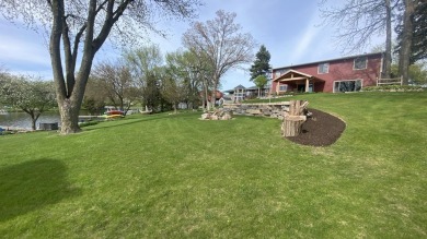 Welcome home to this beautiful, updated, unique charming rustic on Lakes of the Four Seasons Country Club in Indiana - for sale on GolfHomes.com, golf home, golf lot