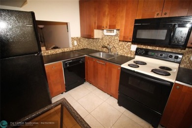 HANDYMAN SPECIAL. SPACIOUS 1BD/1.5BA WITH A BALCONY IN DESIRABLE on Oriole Golf and Tennis Club in Florida - for sale on GolfHomes.com, golf home, golf lot