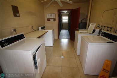 HANDYMAN SPECIAL. SPACIOUS 1BD/1.5BA WITH A BALCONY IN DESIRABLE on Oriole Golf and Tennis Club in Florida - for sale on GolfHomes.com, golf home, golf lot
