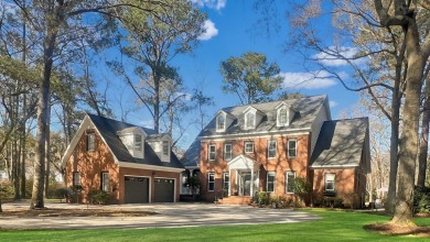 Nestled within the prestigious Coosaw Creek Country Club on Coosaw Creek Country Club in South Carolina - for sale on GolfHomes.com, golf home, golf lot