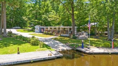 The Ultimate Waterfront Getaway awaits you at in a gated lake on River Golf and County Club at Lake Royale in North Carolina - for sale on GolfHomes.com, golf home, golf lot