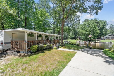 The Ultimate Waterfront Getaway awaits you at in a gated lake on River Golf and County Club at Lake Royale in North Carolina - for sale on GolfHomes.com, golf home, golf lot