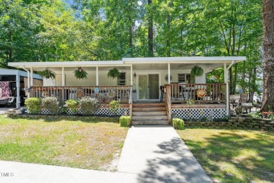 The Ultimate Waterfront Getaway awaits you at in a gated lake on River Golf and County Club at Lake Royale in North Carolina - for sale on GolfHomes.com, golf home, golf lot