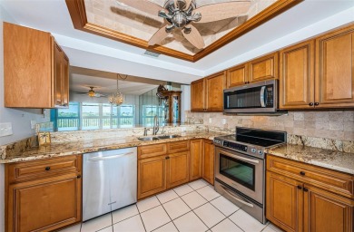 Move-in ready and beautifully remodeled 3 bedroom plus on Seminole Lake Country Club in Florida - for sale on GolfHomes.com, golf home, golf lot