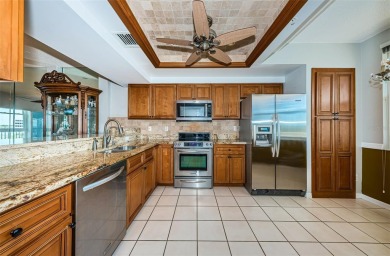 Move-in ready and beautifully remodeled 3 bedroom plus on Seminole Lake Country Club in Florida - for sale on GolfHomes.com, golf home, golf lot