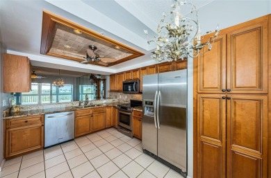 Move-in ready and beautifully remodeled 3 bedroom plus on Seminole Lake Country Club in Florida - for sale on GolfHomes.com, golf home, golf lot