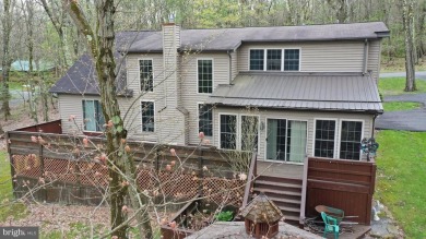 Tucked on a beautiful wooded 0.68 acre lot is this charming on Alpine Lake Resort in West Virginia - for sale on GolfHomes.com, golf home, golf lot