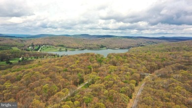 Tucked on a beautiful wooded 0.68 acre lot is this charming on Alpine Lake Resort in West Virginia - for sale on GolfHomes.com, golf home, golf lot