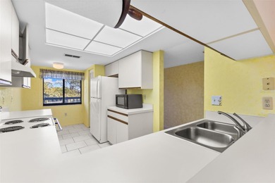 Discover easy, low-maintenance living in the desirable 55+ Green on Tarpon Springs Golf Course in Florida - for sale on GolfHomes.com, golf home, golf lot