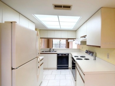 Discover easy, low-maintenance living in the desirable 55+ Green on Tarpon Springs Golf Course in Florida - for sale on GolfHomes.com, golf home, golf lot