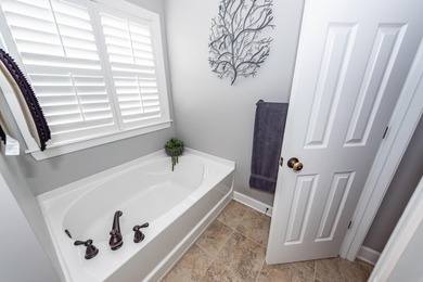 End-unit 4-bedroom, 3-bath townhome thoughtfully maintained in on Charleston National Golf Club in South Carolina - for sale on GolfHomes.com, golf home, golf lot