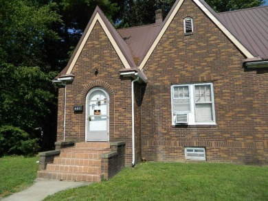 HUGE PRICE REDUCTION!  MOTIVATED SELLER!  A charming Brick Tudor on Fairfield Country Club in Illinois - for sale on GolfHomes.com, golf home, golf lot