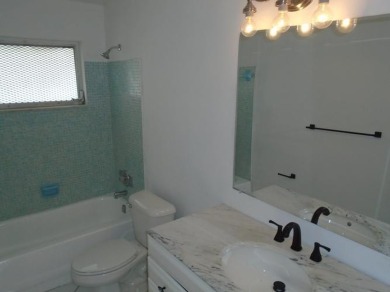 Larger model home in the highly sought-after golf course on Leisureville Community Association in Florida - for sale on GolfHomes.com, golf home, golf lot
