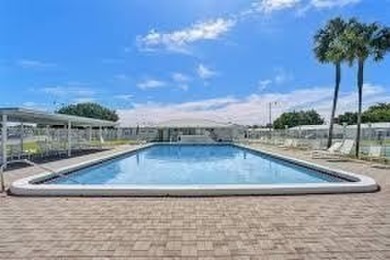 Larger model home in the highly sought-after golf course on Leisureville Community Association in Florida - for sale on GolfHomes.com, golf home, golf lot