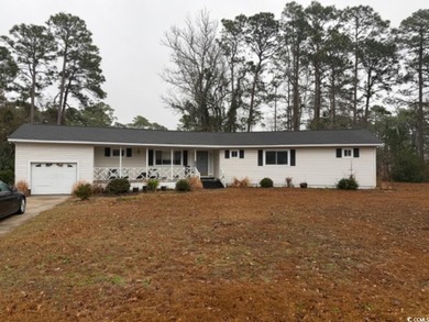 Tucked inside the gated Deerfield community in Surfside Beach on Prestwick Country Club in South Carolina - for sale on GolfHomes.com, golf home, golf lot