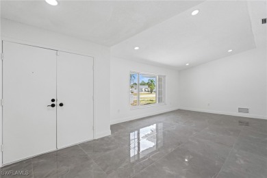 This stunning Renovated home IS STURDY AS STEEL AND NOTHING TO on Port Charlotte Golf Club in Florida - for sale on GolfHomes.com, golf home, golf lot
