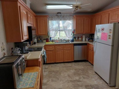 Beautiful Corner Lot partially furnished home with 2 bedrooms, 2 on Pine Lakes Country Club in Florida - for sale on GolfHomes.com, golf home, golf lot