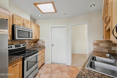 Welcome to this charming single-level attached home in Sun City on Sun City Lakes West and East in Arizona - for sale on GolfHomes.com, golf home, golf lot