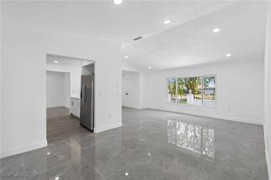 This stunning Renovated home IS STURDY AS STEEL AND NOTHING TO on Port Charlotte Golf Club in Florida - for sale on GolfHomes.com, golf home, golf lot