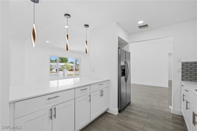 This stunning Renovated home IS STURDY AS STEEL AND NOTHING TO on Port Charlotte Golf Club in Florida - for sale on GolfHomes.com, golf home, golf lot