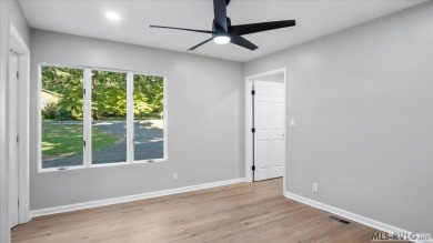 Completely remodeled inside and out, this 3-bedroom, 3-bath home on Tanglewood Shores Golf Club in Virginia - for sale on GolfHomes.com, golf home, golf lot