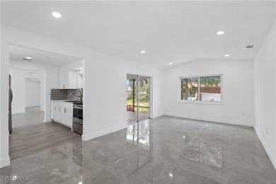 This stunning Renovated home IS STURDY AS STEEL AND NOTHING TO on Port Charlotte Golf Club in Florida - for sale on GolfHomes.com, golf home, golf lot