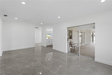 This stunning Renovated home IS STURDY AS STEEL AND NOTHING TO on Port Charlotte Golf Club in Florida - for sale on GolfHomes.com, golf home, golf lot