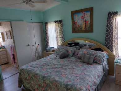 Beautiful Corner Lot partially furnished home with 2 bedrooms, 2 on Pine Lakes Country Club in Florida - for sale on GolfHomes.com, golf home, golf lot