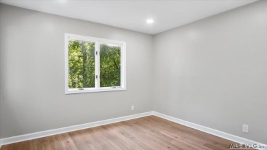 Completely remodeled inside and out, this 3-bedroom, 3-bath home on Tanglewood Shores Golf Club in Virginia - for sale on GolfHomes.com, golf home, golf lot
