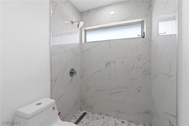 This stunning Renovated home IS STURDY AS STEEL AND NOTHING TO on Port Charlotte Golf Club in Florida - for sale on GolfHomes.com, golf home, golf lot