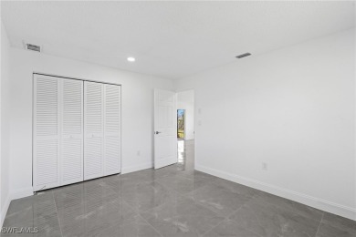 This stunning Renovated home IS STURDY AS STEEL AND NOTHING TO on Port Charlotte Golf Club in Florida - for sale on GolfHomes.com, golf home, golf lot