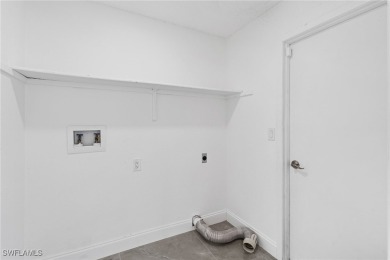 This stunning Renovated home IS STURDY AS STEEL AND NOTHING TO on Port Charlotte Golf Club in Florida - for sale on GolfHomes.com, golf home, golf lot