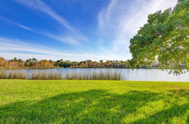 SPECTACULAR VIEW OF WIDE LAKE AND PRESERVE IN THIS  SPACIOUS AND on Jupiter Country Club in Florida - for sale on GolfHomes.com, golf home, golf lot