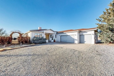 Welcome to this incredible custom home, nestled on a full-acre on Santa Fe Country Club in New Mexico - for sale on GolfHomes.com, golf home, golf lot