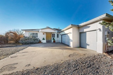 Welcome to this incredible custom home, nestled on a full-acre on Santa Fe Country Club in New Mexico - for sale on GolfHomes.com, golf home, golf lot