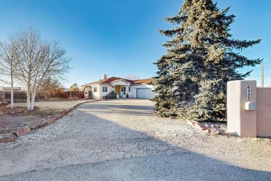 Welcome to this incredible custom home, nestled on a full-acre on Santa Fe Country Club in New Mexico - for sale on GolfHomes.com, golf home, golf lot