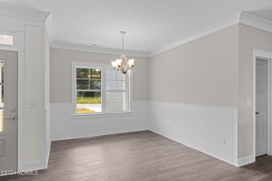 Welcome to 203 Windswept Lane, where modern living meets comfort on North River Club in North Carolina - for sale on GolfHomes.com, golf home, golf lot