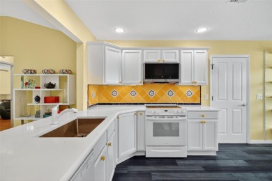 This bright and cheerful, Designer Wisteria, offers 3 bedrooms on The Links of Spruce Creek in Florida - for sale on GolfHomes.com, golf home, golf lot