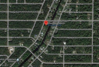 Build your dream home on this stunning waterfront lot in Port on Sabal Trace Golf and Country Club in Florida - for sale on GolfHomes.com, golf home, golf lot