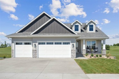 This 2024 Parade of Homes by Hodge Construction overlooks the on Saddleback Ridge Golf Course in Iowa - for sale on GolfHomes.com, golf home, golf lot